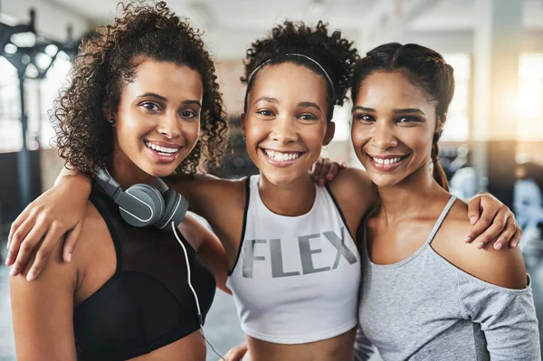 Grab your girls for an awesome gym session. a group of happy young women enjoying their time together at the gym