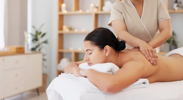 Massage, luxury spa therapy and woman at wellness center for stress, pain relief and to relax body. Calm, peace person and organic zen physiotherapy healthcare treatment at expensive lifestyle resort.