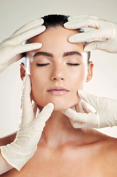 Skincare, plastic surgery and facial filler on woman with dermatology collagen cosmetics. Headshot of a beauty model person with professional hands for medical procedure on face skin.