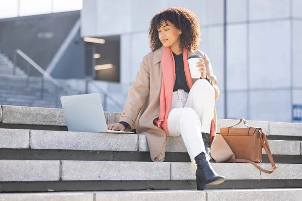 Search, thinking or black woman with laptop in city of London for internet research, communication or networking. Creative, data analysis or remote work on tech for social network, web or blog review.