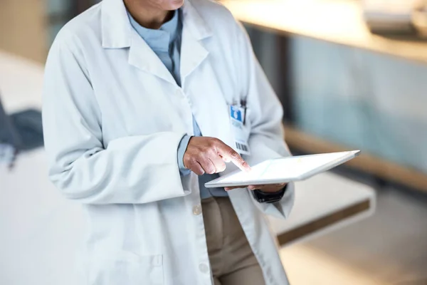 Doctor, hands and tablet with mockup screen for medical research, surgery planning or medicine schedule at night hospital. Woman, healthcare and worker on technology mock up for digital medicine help.