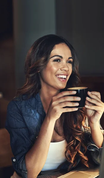 Life is too short for bad coffee. a relaxed young woman enjoying a cup of coffee in a coffee shop