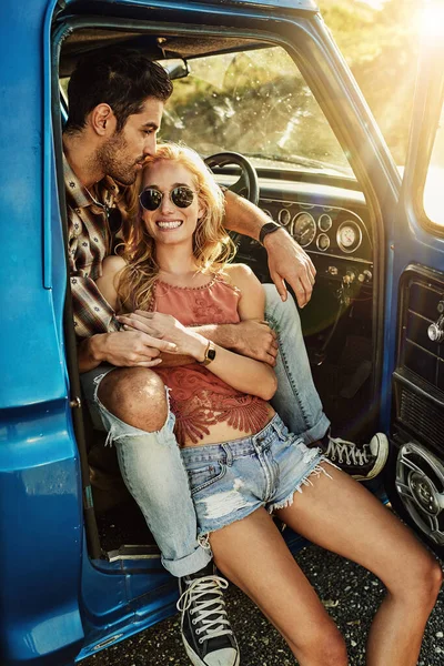 Who doesnt love a road trip. a young couple out on a road trip with their truck