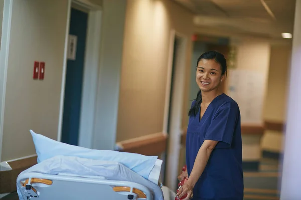 Its ready for the next patient. Cropped portrait of a female nurse standing beside a hospital bed