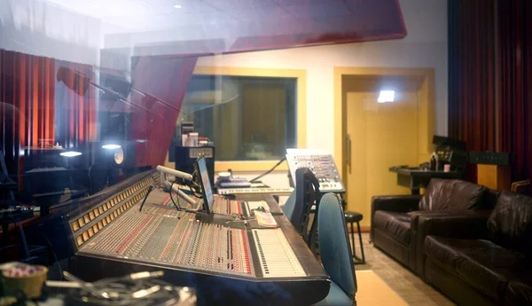 Music, studio and production with audio equipment in an empty room for the entertainment industry. Interior, creative and recrding with musical electronics to produce, enhance or control sound.
