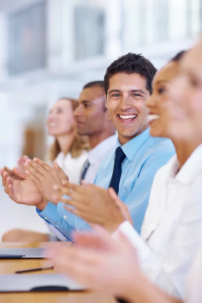 Successful meeting. Portrait of happy professionals clapping after successful meeting