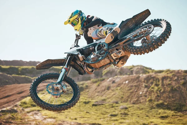 Motorcross, air jump and offroad sports stunt, speed challenge and desert rally. Driver, cycling and freedom on dirt race, competition and motorbike performance on adventure course for fast action.