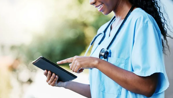 Black woman, doctor and tablet with smile for communication, research or 5G connection in the outdoors. Hands of African American female medical expert or nurse browsing on touchscreen for schedule.
