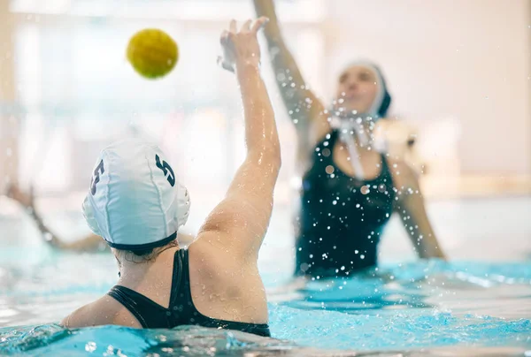 Water polo, sports and team in swimming pool for fitness, exercise and training workout in practice. Professional sport, teamwork and girl athletes with focus for winning game, competition and match.