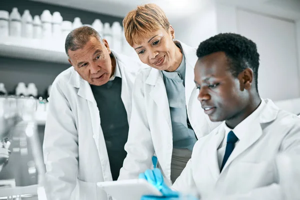 Doctor, research or scientist people with tablet in science lab for DNA search, medical or medicine data analysis. Happy, health teamwork or nurse on healthcare, cancer innovation or virus test study.
