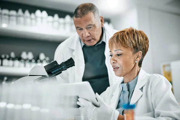 Doctor, teamwork or scientist people with tablet in science lab for DNA research, medical or medicine data analysis. Thinking, healthcare idea or nurse for health, cancer innovation or virus study.