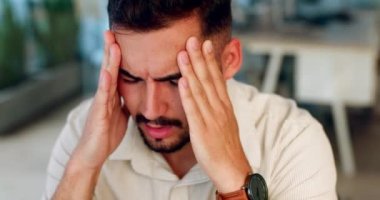 Headache, stress and man with anxiety, pain or frustrated working in business office with mental health problem, Worker, person or employee with burnout risk, migraine or fatigue at workplace crisis.