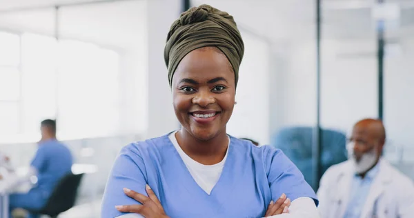 Black woman, healthcare and hospital nurse with arms crossed of medical service, management or surgery. Portrait, smile or happy doctor, surgeon or therapist consulting in clinic, trust or motivation.