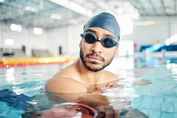 Man, face or swimmer with pool cap, goggles or gear and sports vision, ideas or mindset in Asian water competition. Training, workout or exercise for swimming athlete with fitness goals or healthcare.