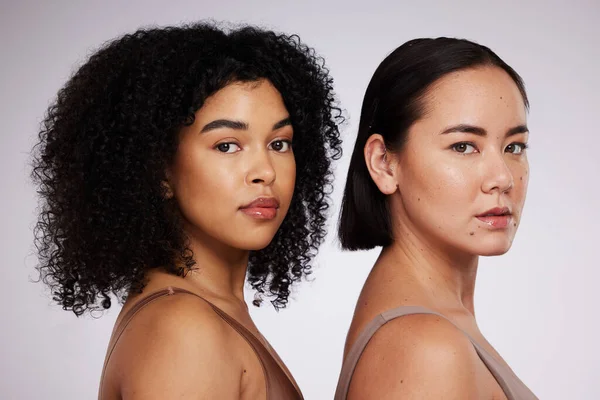 Women, face and diversity with portrait, skincare for different skin color and unique with beauty isolated on studio background. Natural cosmetics, glow and dermatology, inclusion and facial care.