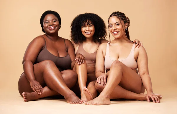 Body, skin and portrait of diversity women group together for inclusion, beauty and power. Aesthetic model friends on beige background for skincare glow, pride and motivation for underwear self love.