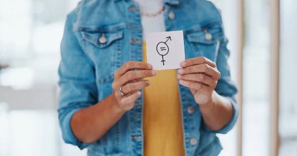 Gender equality, pay gap and woman with a sign in the office with a female and male symbol. Business, equity and girl employee with a feminism card in protest for equal salary, opportunity and equity.