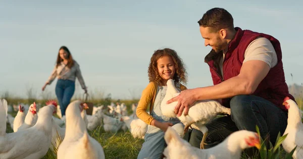 Chicken, farm and family love of happy mom, dad and child enjoy quality time together, talking and bond on countryside field. Poultry farming, free range bird and animal livestock with farmer people.