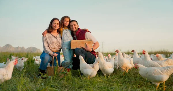 Farm, chicken and portrait of family with livestock in agriculture, sustainable and green field. Ecology, poultry and agro man and woman with girl kid farming with energy in eco friendly countryside