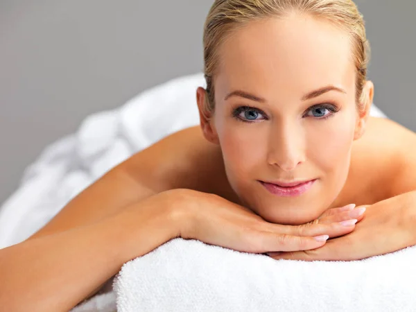 Feeling pampered and beautiful. A beautiful young woman relaxing in a spa