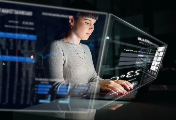 Database, information technology hologram or woman typing to research web design in a smart office. Future overlay or developer with digital ui or ux on a website or software for innovation at night.
