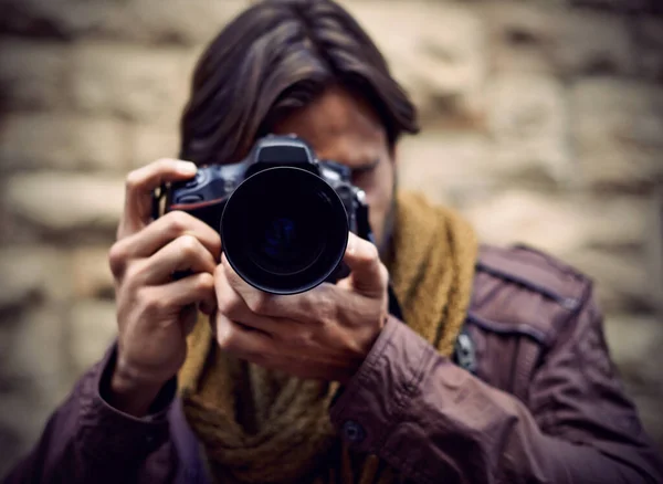 stock image Photography is my passion. a handsome young photographer at work in the city