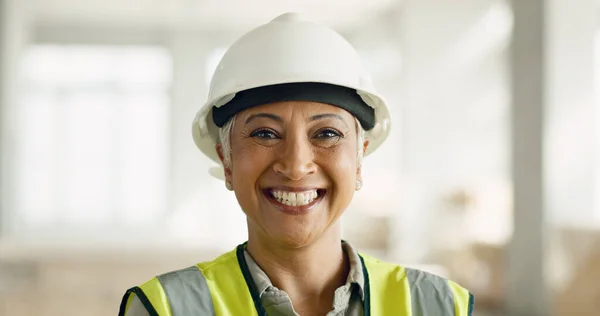 Logistics, construction and architect working on renovation, building development and home maintenance. Face portrait of a mature worker with smile in management of an architecture home project.