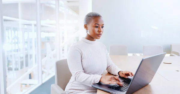 Laptop, business and black woman typing in office workplace. Planning, working and female employee writing sales project, marketing email or advertising strategy, proposal or research on computer