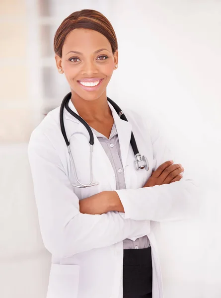 I love my profession. A portrait of an ethnic female doctor with her arms folded and smiling at the camera