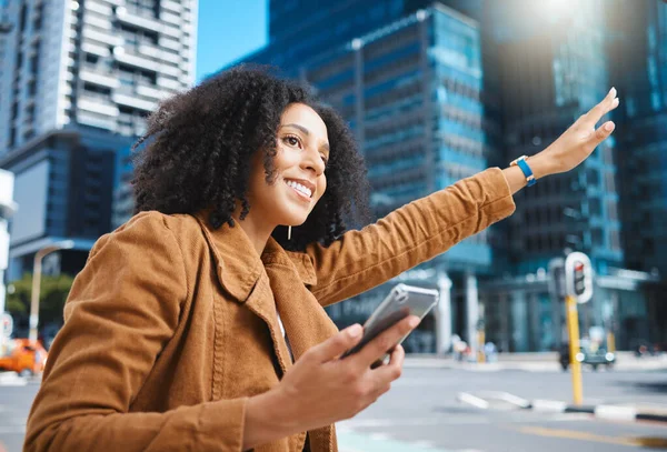 Black woman, city and stop taxi with hand, phone and sunshine on urban adventure in summer. Girl, outdoor on sidewalk or street in metro for transport, bus or ride service with app, holiday or travel.