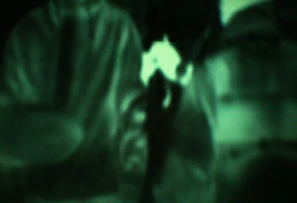 Outlines of soldiers at night - Night vision goggles.