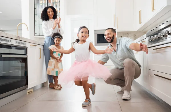 Dance, princess and family with children in home kitchen for love, care and fun bonding together, clapping or celebration. Support, dancing and Mexico girl or kid with parents or mother and father.