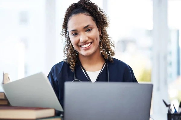 Nurse, laptop or medical student portrait with research books, education studying or learning in university hospital. Smile, happy or healthcare woman on technology in scholarship medicine internship.