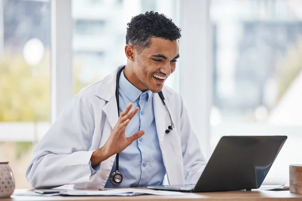 Wave, laptop or black man doctor on video call for online meeting, virtual assistance or medical consulting. Happy, medicine or healthcare nurse on tech webinar for hello, support or wellness help.