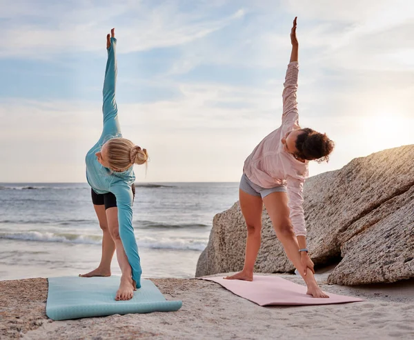 Women friends, beach yoga and smile in morning with stretching