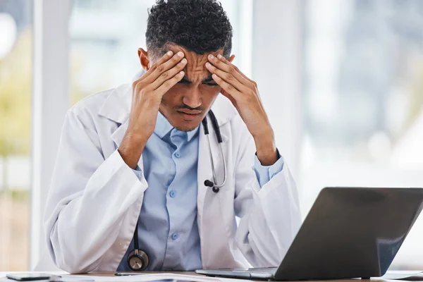 Burnout, stress or man doctor on laptop with headache from depression, mental health or anxiety medical review. Tired, mental health or sad nurse frustrated, angry or depressed from medicine report.