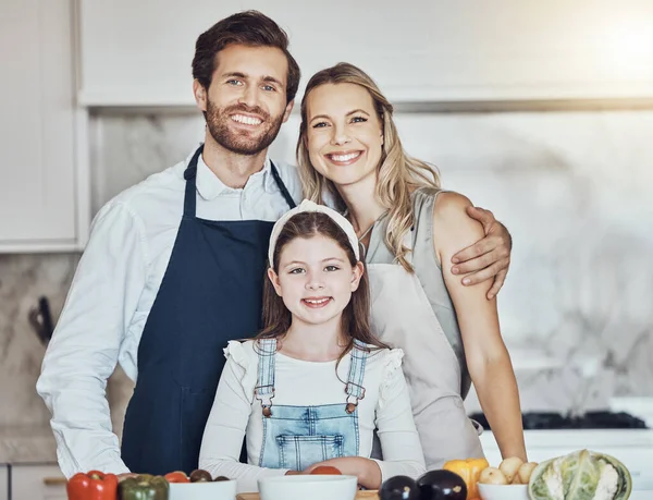 Portrait, parents or girl cooking as a happy family in a house kitchen with organic vegetables in vegan dinner. Mother, father or child love to bond or helping with healthy food diet for development.