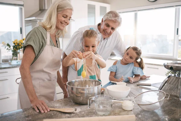 Family, bonding or baking children and eggs, flour or wheat in kitchen, house or home of pastry, dessert cake or food. Happy, grandparents or cooking kids learning a bakery pudding or cookies recipe.