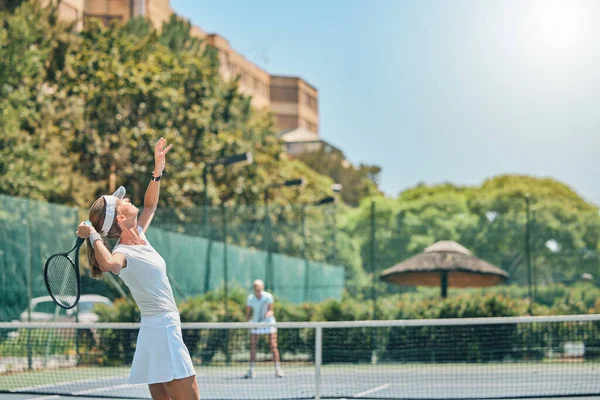 Tennis court, woman and serving for sports competition outdoor for fitness, exercise and training. Healthy people at club for game, workout and performance for health and wellness with summer cardio.
