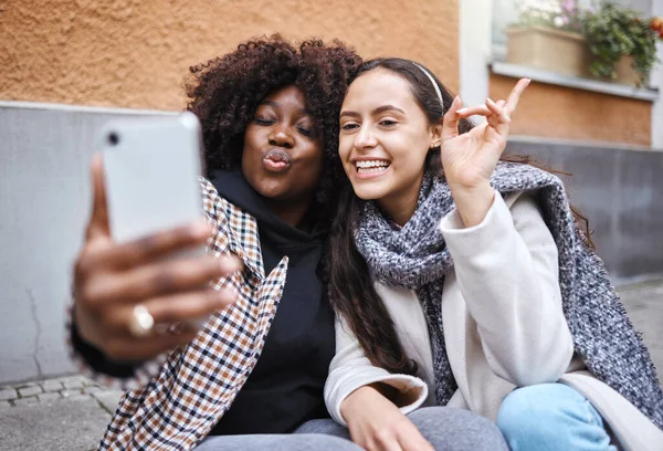 Woman, friends and selfie in the city for profile picture, friendship memory or social media influencer. Happy women smile for photo, online post or vlog in travel, journey or trip in a urban town.