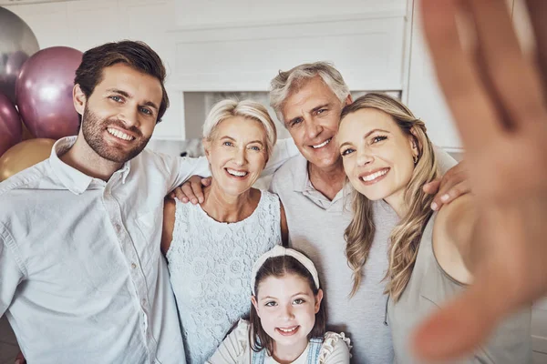 Birthday, party and family selfie in kitchen for happy memory, social media or profile picture. Love, portrait or girl, mother and father with grandparents taking pictures together to celebrate event.