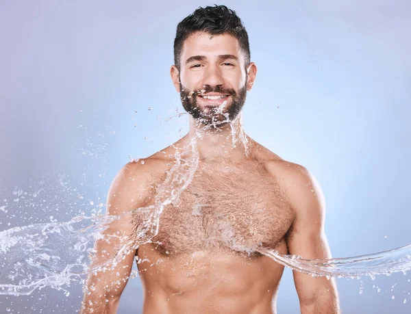 Skin care, face and water splash man portrait for clean facial for beauty hygiene and dermatology. Aesthetic model person on blue background for health and wellness cosmetics, body and detox mockup.