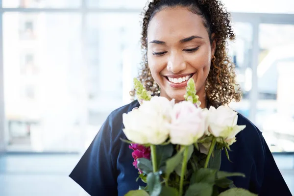 Woman, face and happy for valentines day flowers, love and care as gift for kindness, birthday or romance. Doctor person with rose flower bouquet and mockup space with gratitude, happiness and hope.