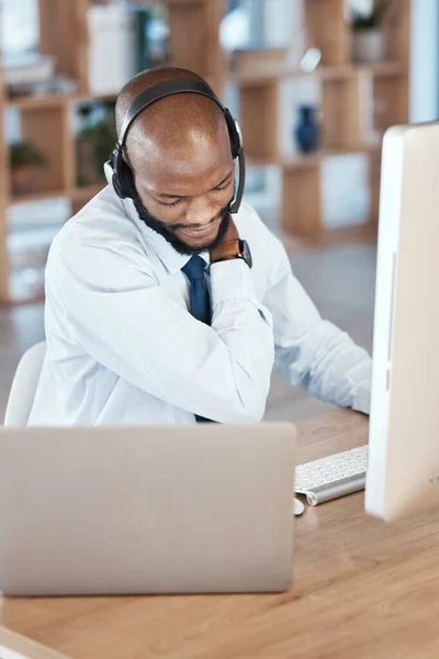 Black man, call center and neck pain by computer for tech support, communication and crm help desk. Telemarketing burnout, contact us and pc at desk for customer service in office with muscle strain.
