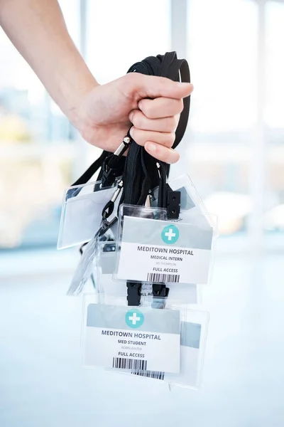 Doctor, hands or ID cards in hospital identification, names or icu pass for clinic help, medical learning or education. Zoom, woman or healthcare worker nurse with tags lanyard for student internship.