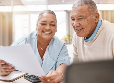 Senior black couple, paperwork and laptop for planning, budget or taxes with discussion for future in home. Old man, woman and conversation for insurance, retirement or finance goals with documents.
