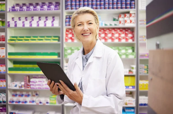 Tablet, pharmacy portrait and pharmacist woman for product management, stock research and inventory. Digital technology, retail software and senior healthcare doctor or person with medicine services.