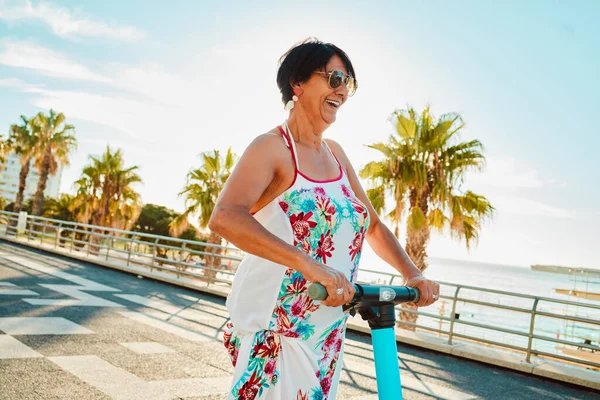 Woman Riding Electric Scooter Happy Retirement Summer Ride Tropical Island — Stok fotoğraf