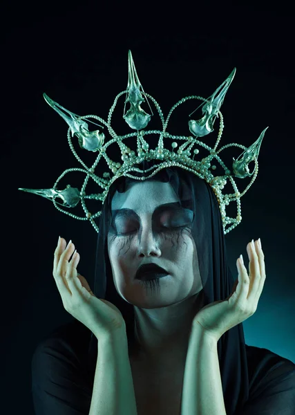 Makeup, dark art and queen woman isolated on black background for fantasy, macabre and beauty character. Vampire, fashion and crown of avatar person or model with cosmetics in night studio mockup.