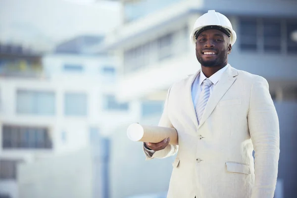 Black man, architect and portrait smile with blueprint for construction, planning or building strategy in the city. African American male contractor smiling with floor plan for architecture on mockup.